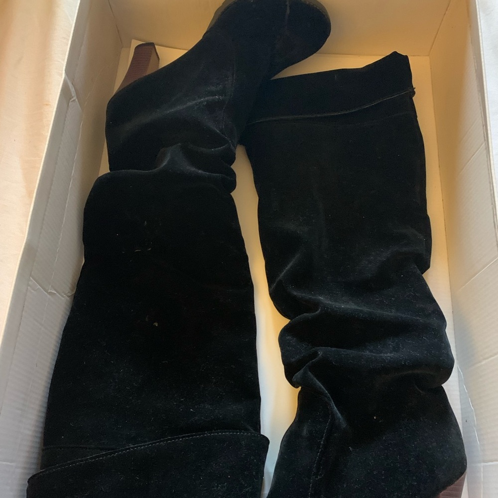 Never worn black knee high boot